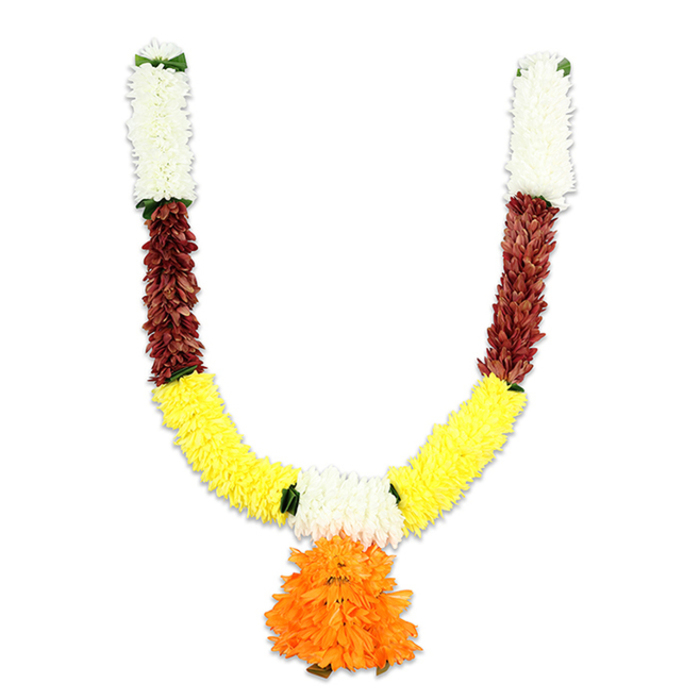 Shown against a stark white field, this U-shaped toran combines classic Indian colour symbolism with careful hand-finished construction - an artful piece you might see welcoming guests to a puja or wedding in Epping. The topmost sections begin with compact, creamy-white florets, densely threaded to create a soft, pillow-like crown that evokes chrysanthemum or small carnation textures and lends a tone of purity and calm. Directly beneath, rich reddish-brown segments appear as tightly packed, textured petals or flattened leaf-like forms, their depth and warmth grounding the garland. The arms curve down into a generous band of saturated golden yellow: fluffy, marigold-like clusters that form the broad U and radiate celebratory brightness. A dramatic central pendant of bright orange blossoms - layered, ruffled and voluminous - hangs from the lowest point, serving as a bold focal tassel whose colours shift from deep saffron to lighter orange at the edges. Fine green accents are woven at colour transitions, simulating leaf joins and giving the design visual relief. The materials read as quality artificials - resilient fibres, neat stitching and weight sufficient to drape well - making this toran practical for repeated festival use, temple decoration, or as a permanent doorway adornment for Epping households. As a local florist supplying items for markets near the town centre and community events by St John's Church and Epping Forest, I would pair this with simple string lights and an incense burner to create a welcoming ceremonial display that balances tradition, durability and seasonal cheer. (Available locally through Flowers Epping on flowersepping.info.)