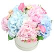 This pastel bouquet, freshly imagined by a local artisan, sings with soft colour and quiet grace. Crowned by a round white hat box, it feels like a small piece of spring arriving on a doorstep. Billowy blue hydrangeas mingle with frilled pink peonies, their petals layering like delicate sunrise. Wisps of pale roses and a scatter of blush calla lilies add sculptural lines, guiding the eye through the arrangement with quiet confidence. The scent rises lightly-the clean perfume of peonies, balanced by hydrangea's cool freshness-while the box's crisp white surface makes the colours appear even more luminous. This bouquet reads as a heartfelt gesture of congratulations or comfort, a reminder that beauty and kindness can exist in the simplest moments. Crafted with care by Flowers Epping for clients across Epping and the surrounding towns, it embodies local pride and thoughtful craft. In the hands of a seasoned florist, every stem is placed to harmonize light, shade, and texture, so the piece feels both timeless and contemporary. It's the sort of arrangement that graces a living room with quiet joy, or arrives as a tender note at a doorstep, carrying with it a promise of fresh, hopeful days in the Epping community.